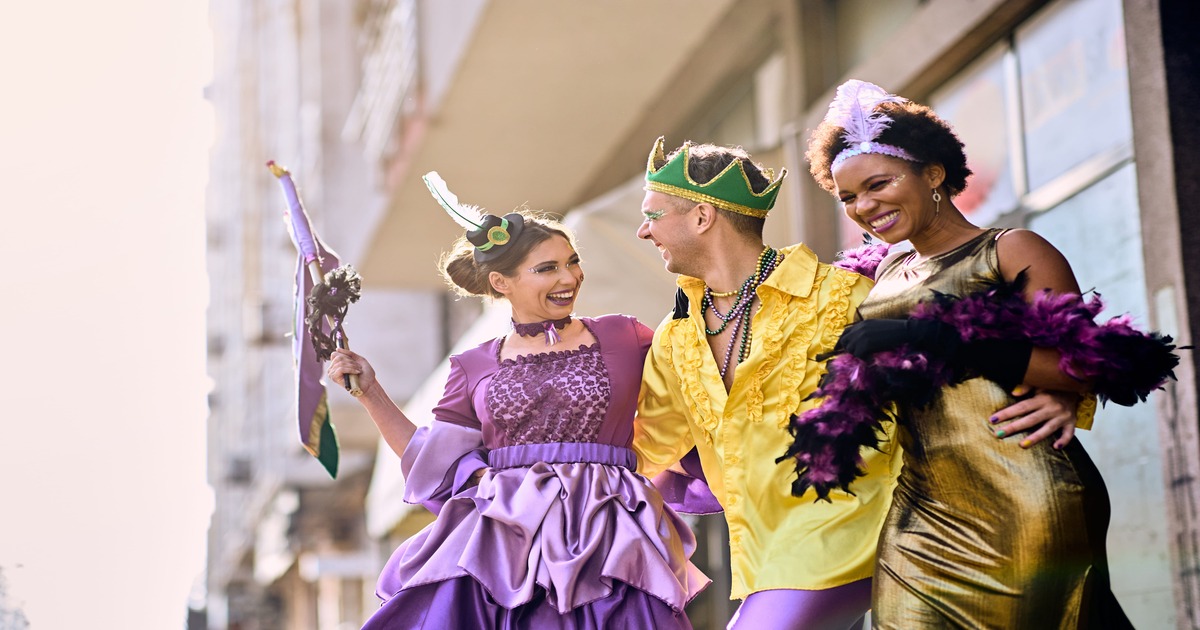 3 people celebrating mardi gras