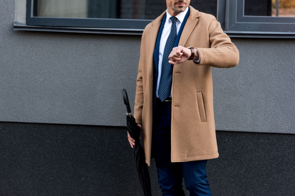 trench coat layered over a suit