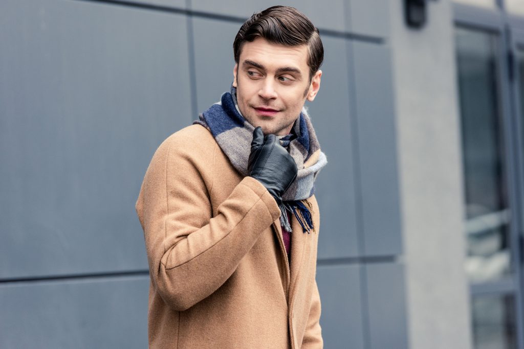 trench coat styled with scarf and leather glove